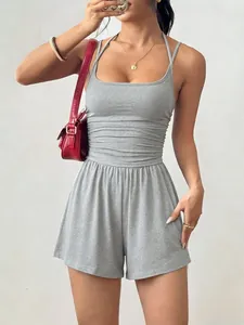 Close-up of grey ribbed halter neck romper showing the cinched waist and soft fabric