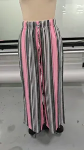 Close-up of pink and grey striped wide-leg pants with elastic drawstring waist
