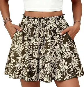 Detailed view of high-waisted floral A-line shorts with elastic waistband and pockets