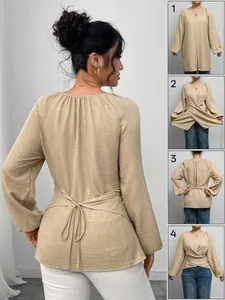 Detaillierte Styling-Schritte für beiges Langarm-Top mit Bindegürtel und Saum