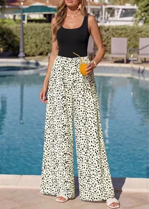 Chic square neck sleeveless jumpsuit with polka dot wide-leg pants by pool