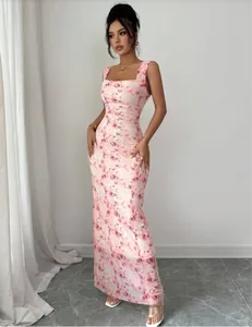 Front view of pink floral print sleeveless maxi dress with a slim fit and square neckline.