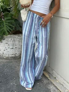 Detail view of blue striped wide-leg trousers with drawstring waist for summer