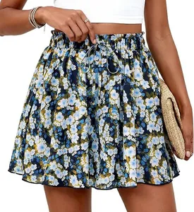 Detailed view of high-waisted floral A-line shorts with drawstring waist and blue print.