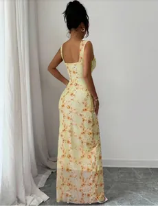 Back view of a slim-fit long summer dress with orange floral prints and square neckline