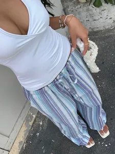 Stylish blue striped wide-leg drawstring pants for a casual beach holiday look.
