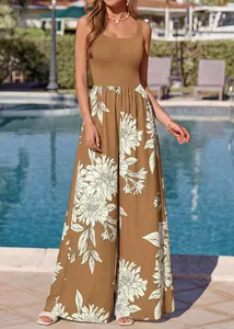 Full view of summer brown floral jumpsuit worn by model at a luxury poolside setting