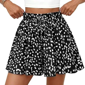 Close-up of black and white floral high waist A-line shorts with adjustable drawstring