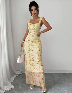 Full-length detailed view of yellow floral print maxi dress with slim backless design