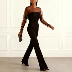 Combinaison noire élégante pour femme avec manches en tulle transparent et col bandeau.