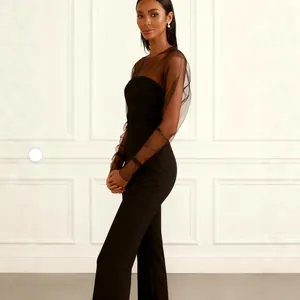 Combinaison moulante noire élégante pour femme avec manches longues en tulle transparent