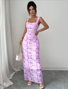 Model wearing a square neck purple floral maxi dress standing in a minimalist interior