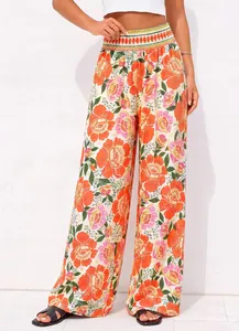 Pantalon large à taille haute élégant avec un imprimé floral vibrant pour l'été