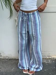 Close-up of blue striped wide-leg trousers showing adjustable drawstring and fabric texture
