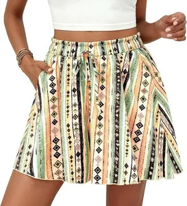 Detail view of high waisted bohemian A-line shorts featuring vibrant geometric tribal print
