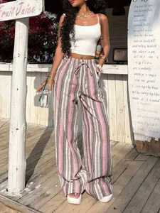 Detailed view of pink and grey striped wide-leg resort trousers with drawstring waist