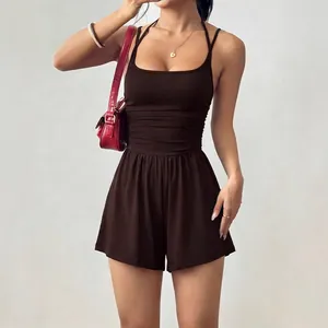 Elegant sleeveless brown halter neck romper featuring ruched waist and wide leg shorts