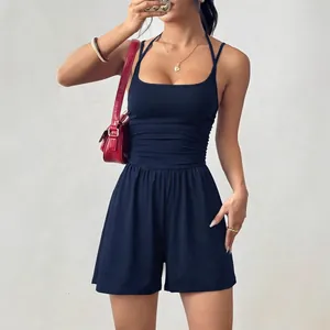 Navy blue halter neck romper with cinched waist and wide-leg summer casual jumpsuit