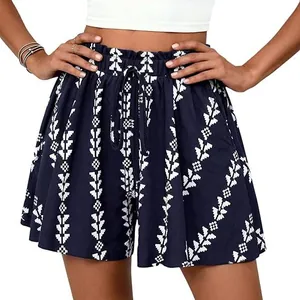 Detail showing high-waisted navy shorts with white tribal print and drawstring waist.