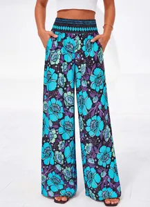 Pantalon large décontracté à fleurs avec une taille haute smockée pour l'été