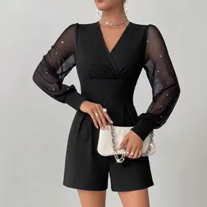 Eleganter schwarzer V-Ausschnitt taillierter Langarm-Mesh-Patchwork-Kurz-Jumpsuit