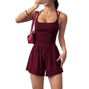 Elegant burgundy sleeveless romper with pleated waist and wide-leg shorts for summer wear