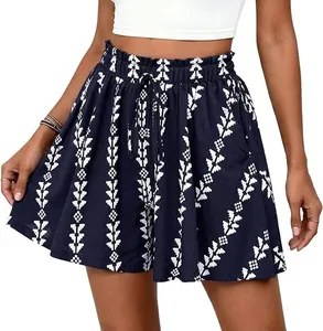 High-waisted navy blue floral A-line shorts with elastic ruffle waist and drawstring.