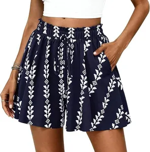 Detailed view of high-waisted navy A-line shorts with geometric tribal print and pockets