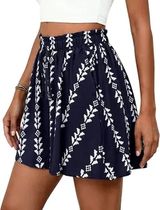 Detail view of high-waisted navy blue A-line shorts with white tribal pattern and drawstring