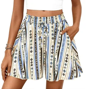 Detailed view of high-waisted A-line shorts with bohemian geometric print and drawstrings.