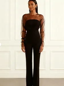 Combinaison noire élégante pour femme avec manches longues en mesh et coupe ajustée