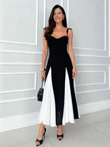 Elegant French style midi dress featuring black and white contrast and tie-up straps