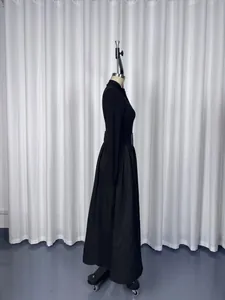 Side view of an elegant French style black long-sleeved Hepburn maxi dress for women