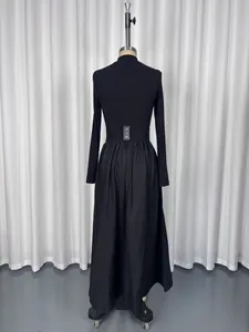 Rear view of an elegant black long-sleeved Hepburn style maxi dress for women