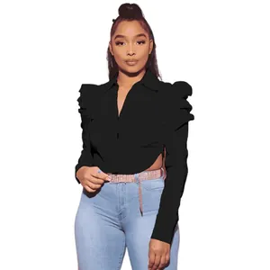 Fashionable black long sleeve shirt with puff shoulders and waist cut-out design