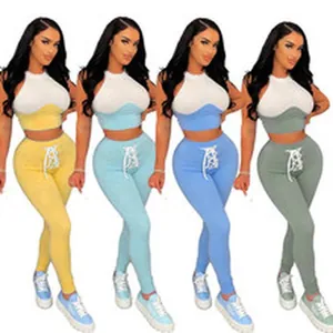 Multiple color options of two-piece halter crop top and lace-up leggings set