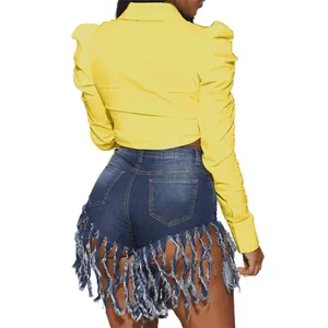 Back view of stylish yellow cropped puff sleeve lapel shirt with fringe denim shorts