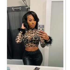 Trendy leopard print long-sleeve mesh crop top featuring chic feather trim cuffs