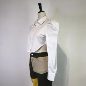 Side view detail of white puff sleeve cropped shirt with asymmetric waist cut-out