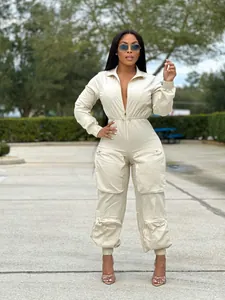 Stylish beige cinched waist cargo jumpsuit for women featuring multi-pocket utility design