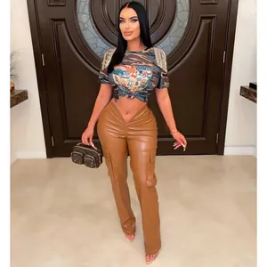 Full length photo of model wearing low waist brown PU leather straight leg cargo pants