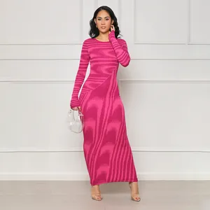 Elegant long sleeve bodycon maxi dress featuring a vibrant irregular pink abstract pattern