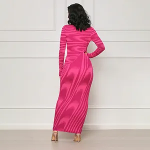 Back view of elegant pink irregular print bodycon long sleeve maxi dress with slim fit design