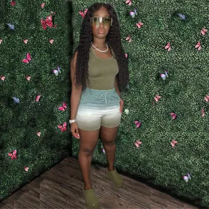 Model wearing a women's olive green racerback tank and gradient shorts 2-piece set