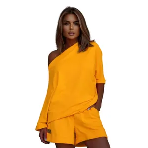 Stylish yellow one-shoulder sweatshirt and shorts set for women's fashion