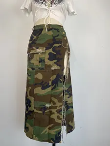 Detailed view of a camouflage maxi skirt featuring a high side slit and distressed hem edges.