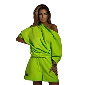 Vibrant neon green two-piece set with off-shoulder sweatshirt and shorts for women