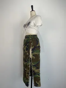 Side view of a camouflage maxi skirt with high slit and frayed edges shown on mannequin.