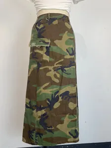 Detailed side view of women's washed camouflage cargo skirt with frayed utility pocket