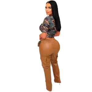 Back view detail of brown PU leather cargo pants with camouflage crop top